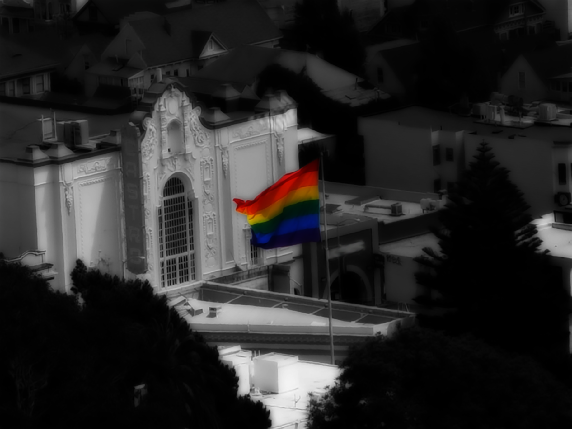 A rainbow LGBTQ rainbow flag flying above the Castro District, San Francisco, Jul-03