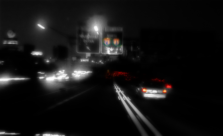 A photo of nighttime driving along I-75 in Atlanta, GA